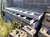 a pile of concrete blocks sitting next to a building