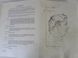 an open book with a drawing of a man ' s face on it