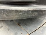 a close up view of a car ' s bumper with rust on it