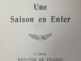 an open book with a black and white image of a bird on it