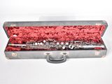 a flute that is in a case on a table