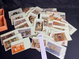 a pile of cards with pictures on them on a table