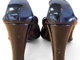 a pair of high heeled shoes on a white surface