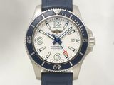 a white and blue watch with a red second hand