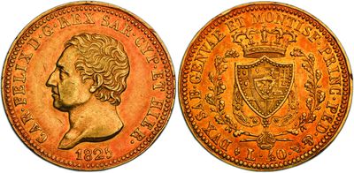a gold coin with a head of a woman and a shield on it
