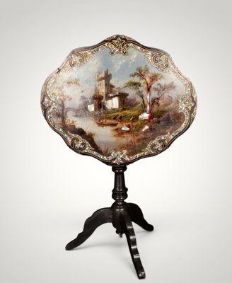 an ornately decorated table with a painting on it