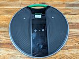 a black and green vacuum cleaner on a wooden floor