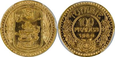 a close up of two gold coins on a white background