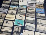 some old photos of airplanes and planes are on a table