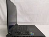 the laptop is sitting on a table with a white background