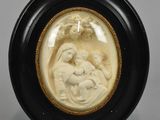 an image of a picture of a woman holding a child in a black frame