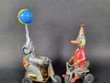 toy figurines of a clown riding a scooter and a clown on a scooter