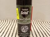 an image of a bottle of sealil on a striped tablecloth