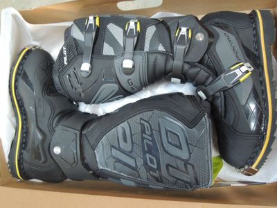 a box with a pair of motorcycle gloves in it