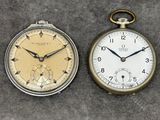 two different types of pocket watches on the table