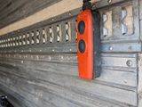an orange object hanging on the side of a garage door