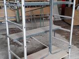a metal cart that is sitting in the middle of a room
