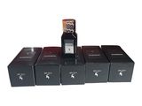 five boxes of perfumes and a remote on a white background