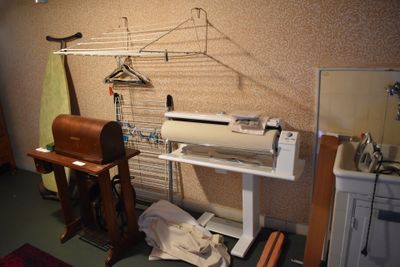 an image of a sewing machine in a small room