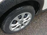 a close up of a car tire on the road