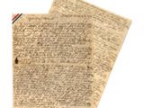 un gros plan d'un morceau de papier sur lequel on a écrit