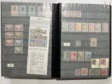 a lot of stamps on the pages of a book