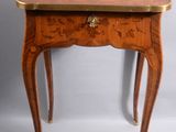 an image of a small table with a drawer on it