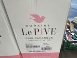 boxes of wine are stacked on top of each other in a store