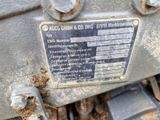 a close up of a metal sign on a machine