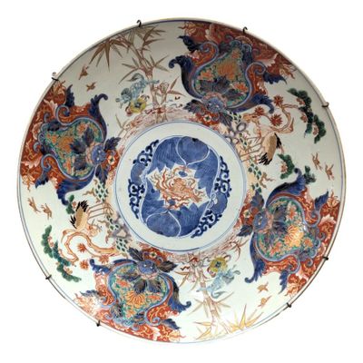 a large plate with a peacock design on it