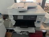 a printer that is sitting on top of a desk