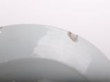 a close up of a white bowl with holes in it