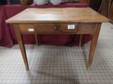 a wooden table with a drawer on top of it
