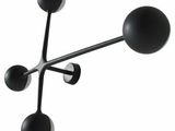 an image of a black and white clock with three balls