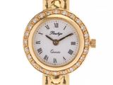 a close up of a gold wrist watch with a white dial