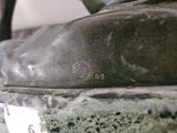 a close up of a bronze statue of a person