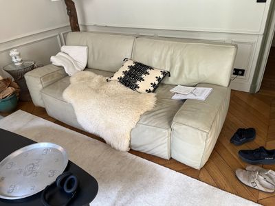 a couch that has a pillow on it in a living room