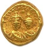 une pièce d'or portant l'image d'un homme et d'une femme