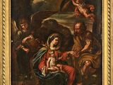 un tableau représentant une femme tenant un enfant dans ses bras