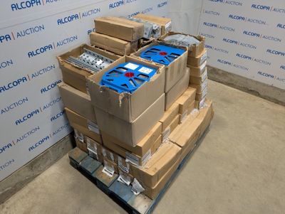 a stack of boxes on a pallet in front of a wall