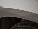 a close up of a tire with a tire tread underneath it
