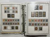 an open book with stamps on it on a table