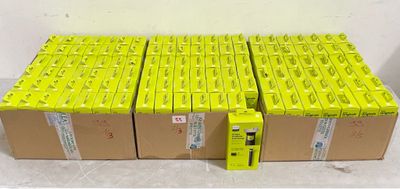 several boxes of yellow batteries are stacked on top of each other