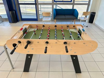 a foosball table in the middle of the room