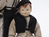 two dolls that are sitting next to each other