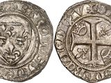 a silver coin with a cross on the front and a shield on the back
