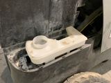 a white toilet in the back of a truck