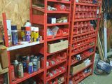 a room with a lot of shelves and bins of items