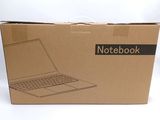 a cardboard box with a laptop in it on a white surface