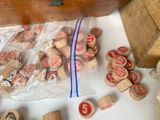 a bag full of stamps and a wooden box full of stamps